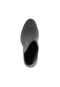 Scarpa slip-on grigia con esterno in suede liscio, fodera in morbida pelliccia e punta arrotondata. La suola appare piatta e leggermente texture.