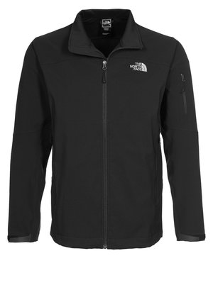 Veste noire North Face zippée intégrale avec col montant, poches poitrine et manches zippées, et logo sur la poitrine gauche.