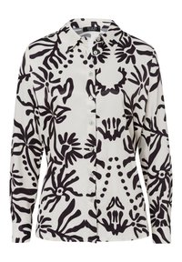 White blouse with bold black abstract floral patterns, long sleeves, button front, and classic collar. Smooth fabric with a polished finish.