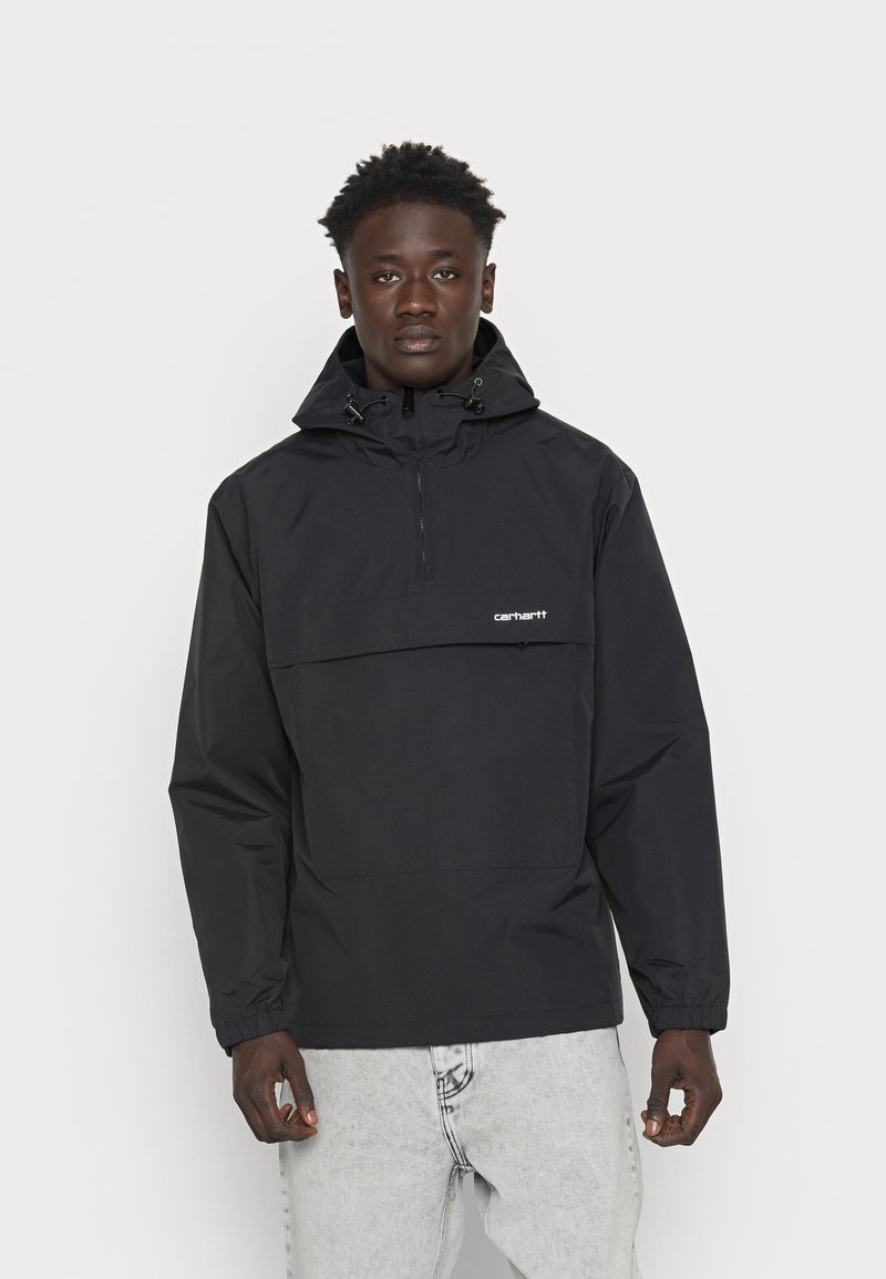 Black windbreaker jacket with a front pocket, adjustable hood, and elastic cuffs. Made from a lightweight, water-resistant fabric.