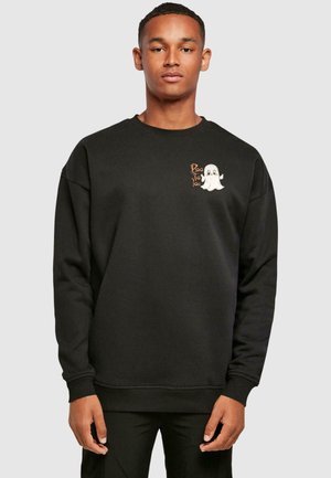 Sort sweatshirt med et spøgelse grafik og teksten "Boo to You" i orange. Løs pasform, ribbede manchetter og halsudskæring. Blandingsmateriale af bomuld.
