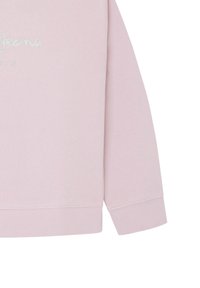 Ljusrosa sweatshirt med långa ärmar. Har ribbade muddar och nederkant, med glittrig textdetalj på framsidan. Mjuk tygkvalitet.