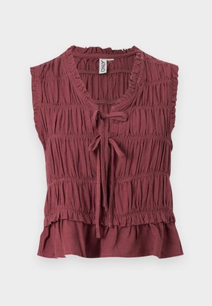 Μπλούζα χωρίς μανίκια σε μπορντό χρώμα με μαζεμένο ύφασμα, λαιμόκοψη σε σχήμα V, κλείσιμο με κορδόνι μπροστά, βολάν στο τελείωμα και ετικέτα με το εμπορικό σήμα μέσα στον γιακά.