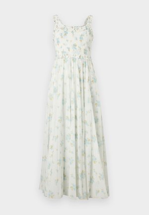 Robe maxi blanche sans manches avec corsage smocké, bretelles à volants et imprimé floral bleu et jaune.