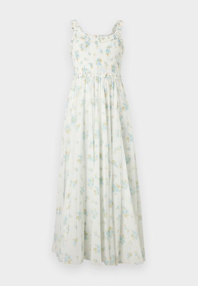 Λευκό μακρύ φόρεμα χωρίς μανίκια με κρεπ κορσέ, βολάν τιράντες και μπλε και κίτρινο floral σχέδιο.