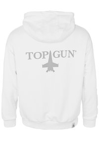 Vit huvtröja med en grå "TOP GUN" logotyp och en stiliserad flygplansgrafik på baksidan. Mjuk textur med ribbade muddar och fåll.