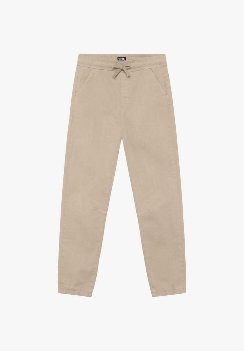 Beige elastische Hosen mit Kordelzug am Bund, zwei Seitentaschen und zulaufenden Bündchen. Glatter Stoff mit subtiler Textur.