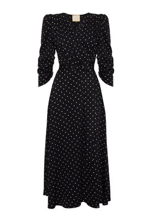 Czarna sukienka o kroju kopertowym z długimi bufiastymi rękawami, w kremowe kropki, z dopasowanym pasem i zwiewnym dołem. Lekki materiał o gładkiej fakturze.