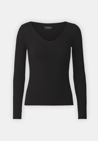 Schwarz gestreiftes Langarmoberteil mit V-Ausschnitt. Glattes Material und taillierte Silhouette. Etikett am Ausschnitt.