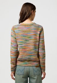 Knit sweater in multicolor striped pattern with ribbed cuffs and hem. Round neckline and medium weight fabric. Back view showcased.