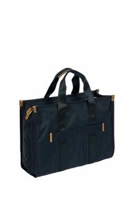 Borsa a spalla bleu navy con due manici robusti, un accento in pelle marrone e una forma rettangolare. Presenta una tasca con zip sul lato.