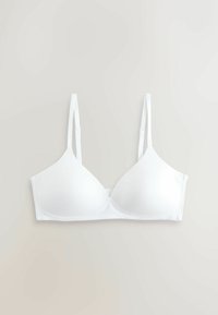 Soutien-gorge blanc sans coutures avec bretelles réglables, posé à plat sur un fond clair, montrant les détails avant et latéraux.