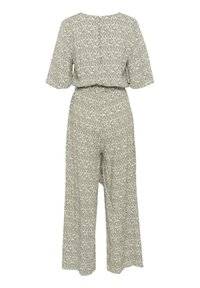 Siva vzorčasta kombinezona s kratkimi rokavi, sproščenega kroja, širokimi nogami in pasom okoli pasu. Tkanina ima subtilno teksturo.