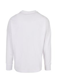 Hvid langærmet skjorte lavet af bomuld, har en rund halsudskæring, sidesømme og lige snit med håndledsmanchetter. Minimalistisk design.