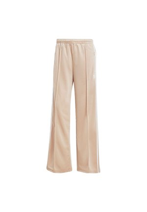 Beżowe dresy wykonane z gładkiego materiału, o luźnym kroju, z elastycznym pasem na sznurek i subtelnymi bocznymi paskami.