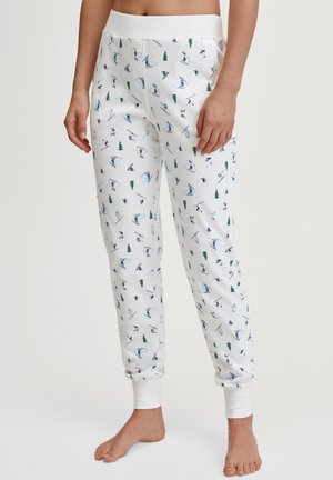 Katoenen loungebroek met een witte basis, met een print van skiërs en bomen in blauw en groen. Elastische tailleband en opgerolde enkels.