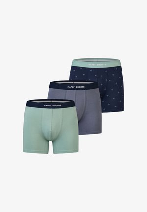Three pairs of men’s boxers: one light green, one grey, and one navy blue with a subtle print. All feature a soft, elastic waistband labeled "HAPPY SHORTS."