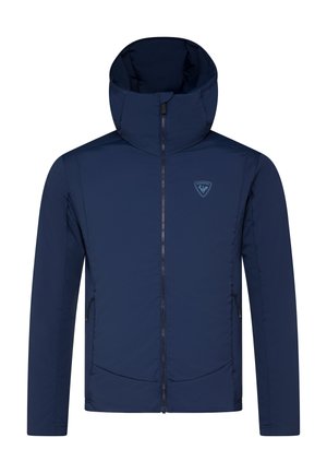 Navy blue insulated jacket with a high collar, full zip, side pockets, and a logo on the chest. Features a smooth, matte texture.