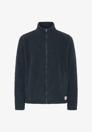 Flis jakna u tamnosivoj boji s visokim ovratnikom, punim prednjim zatvaračem i mekanom teksturom. Ima mali logotip pri dnu.