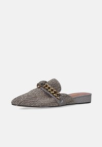 Textured slip-on shoe in a brown and black check pattern with a low heel, featuring a decorative gold chain and a rounded toe.