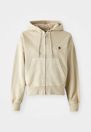 Khakifarbener Zip-Hoodie aus weicher Baumwolle mit einer vorderen Kängurutasche, verstellbarem Kapuzenschnürzug sowie gerippten Bündchen und Saum. Carhartt-Logo auf der Brust.