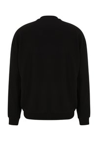 Sweatshirt noir avec un col rond, des manches longues et des poignets côtelés. Texture lisse, coupe décontractée et sans logos ni motifs visibles.