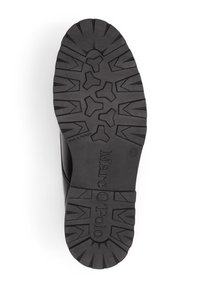 Black rubber shoe sole featuring a rugged tread pattern and embossed brand name "Marc O'Polo," marked with size 42 and "Made in Portugal."