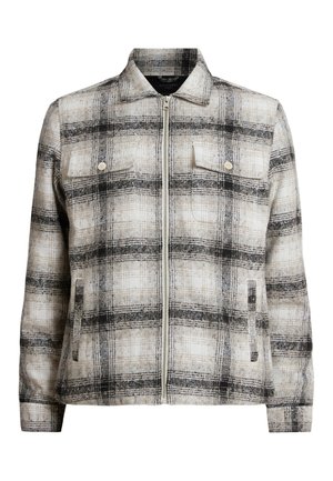 Leichter karierter Mantel in Beige und Schwarz. Verfügt über einen Kragen, einen Reißverschluss, zwei Brusttaschen und Seitentaschen. Texturiert mit einem Karomuster.