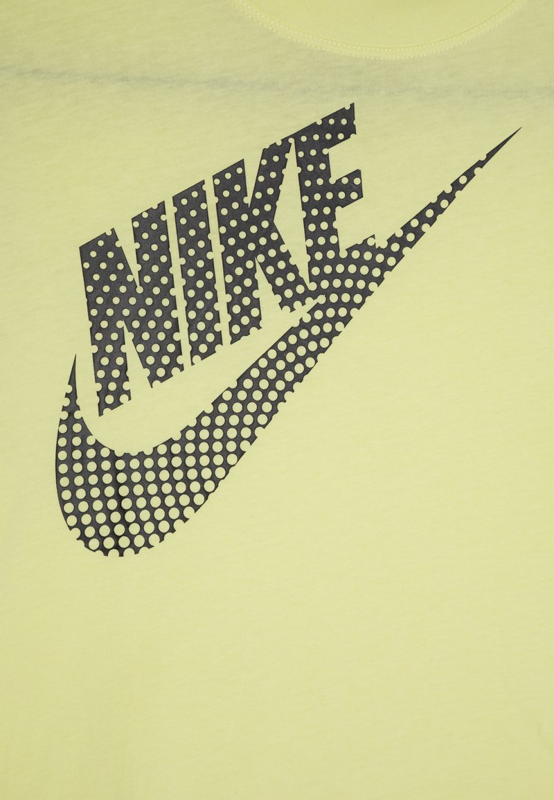 green and yellow nike shirt