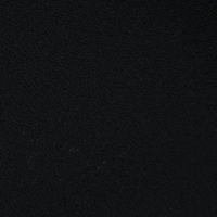 Matériau noir texturé avec une finition lisse, présentant des marquages subtils et une couleur uniforme. Convient à diverses utilisations.