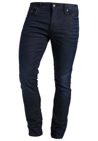 Dark denim jeans with a slim fit, featuring five pockets, a button fly, and subtle stitching details.