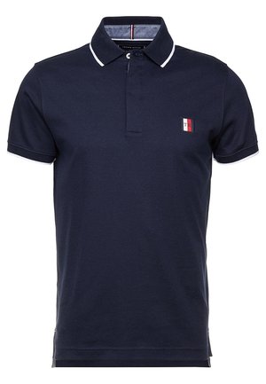 Navy blue short-sleeve polo shirt with white trim on collar and sleeves, featuring a small rectangular red, white, and blue logo on the chest.