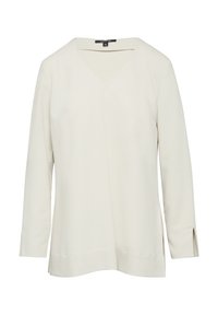 Helle beige Langarmbluse mit V-Ausschnitt. Glatte Stoffqualität, Seitenschlitze und lockerer Schnitt. Keine sichtbaren Muster oder Hardware. Minimalistisches Design.