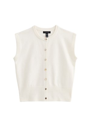 Gilet blanc sans manches avec ourlet et col côtelés, comportant sept petits boutons dorés sur le devant.