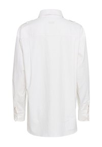 Valkoinen pitkähihais shirt kevyt kangas. Ominaisuuksia ovat kaulus, napilliset hihansuut ja olkasuojukset, joissa on huomaamaton tikkaus. 