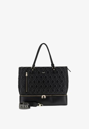 Sac cabas matelassé noir Guess avec double poignée, poche avant zippée, poche inférieure zippée et bandoulière amovible avec logo.