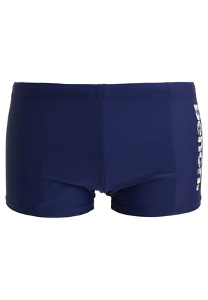 Navy blue swim shorts made of stretchy fabric. Features a fitted design with a logo print on the side and an elastic waistband.