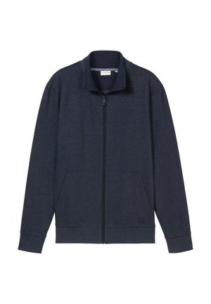Veste zippée marine avec un col montant, deux poches avant et des poignets côtelés. Fabriquée en tissu doux et texturé, avec un logo sur la poitrine.