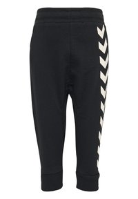 Pantalons de jogging noirs avec une taille côtelée et des chevilles resserrées. Présente un motif en chevrons crème sur le côté pour le contraste. Tissu doux et lisse.
