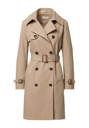 Beżowy dwurzędowy trencz z szerokimi klapami, paskiem w talii, zapinanymi na guziki mankietami oraz przednimi kieszeniami.