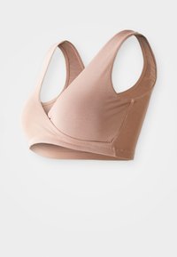 Gaiši brūns sporta krūšturis ar V veida izgriezumu, platām plecu siksnām un gludu, elastīgu audumu. Tam ir bezšuvju apdare un nav stiept tērauda.