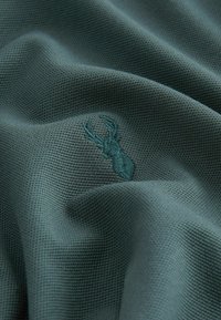 Next Polo - green emerald