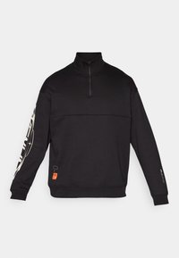 Black pullover sweatshirt with a high collar, half-zip, and long sleeves. Features textured paneling and white graphic designs on the sleeve.