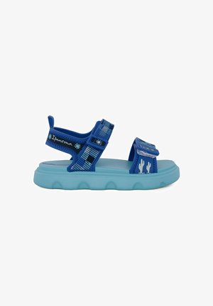 Sandalo blu regolabile con punta aperta, suola azzurra chiara, grafica di cactus sulla fascia anteriore e marchio "Ipanema" sulla fascia alla caviglia.