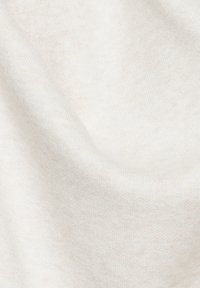 Texturiertem cremefarbenes Gewebe mit einer sanften, glatten Oberfläche, das einen leichten Glanz und subtile Farbvariationen aufweist. Ideal für leichte Kleidung.
