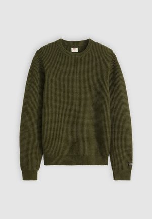 Olive green knitted sweater with a round neckline, textured rib pattern, long sleeves, and a small logo tag on the left sleeve.
