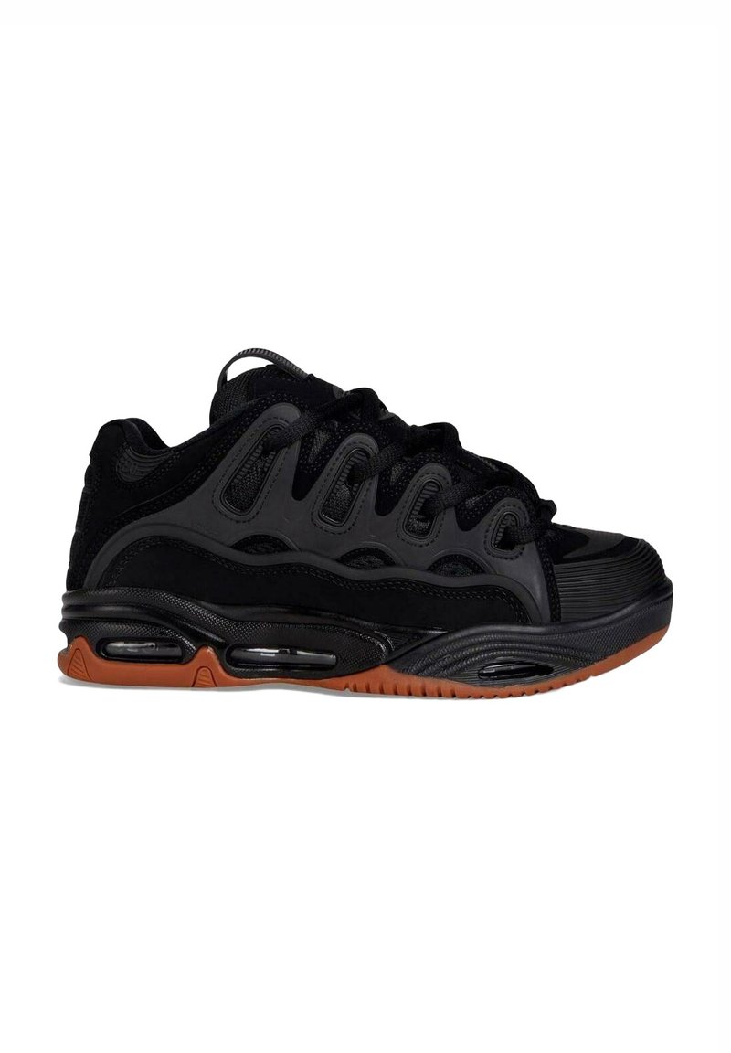 Scarpe sportive nere con tomaia in mesh testurizzato, suola in gomma, ammortizzazione ad aria visibile e suola in gomma per una migliore aderenza.