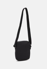 Tommy Jeans HERITAGE REPORTER UNISEX - Sac bandoulière - black