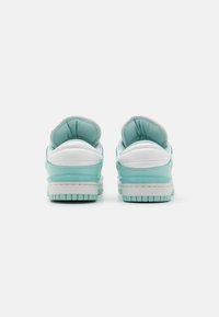 Aquamarine sneakers with white accents, padded collar, and textured rubber sole. Features smooth material and flat laces.