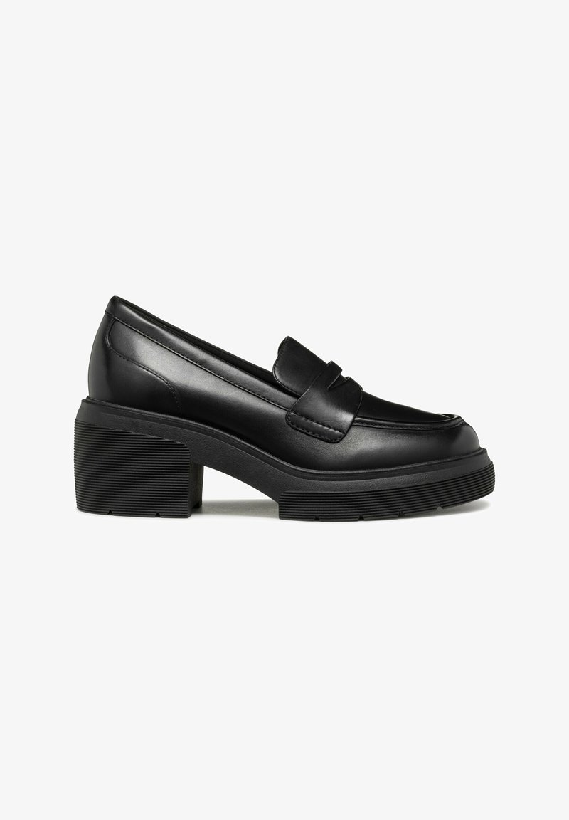 Black leather loafers with a rounded toe, feature a strap detail, chunky textured heel, and ridged rubber outsole.